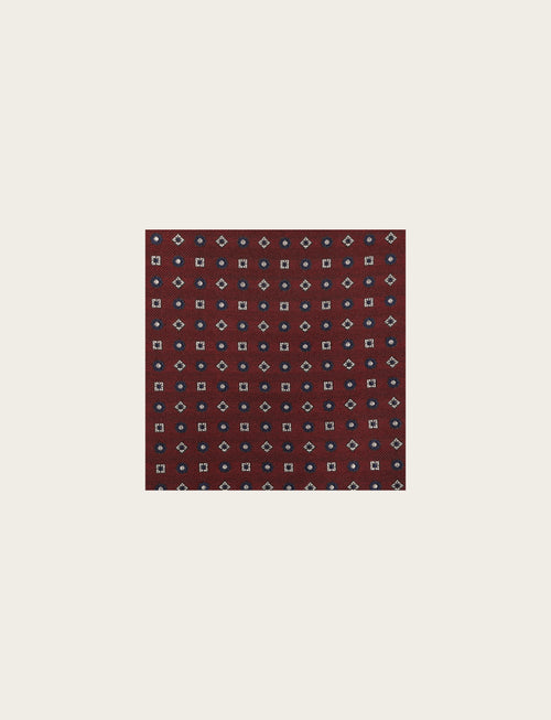 Pochette in seta micro fiori e rombi stilizzati
