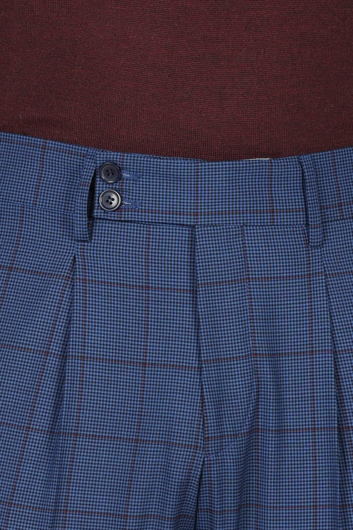 Pantaloni check con pinces in lana