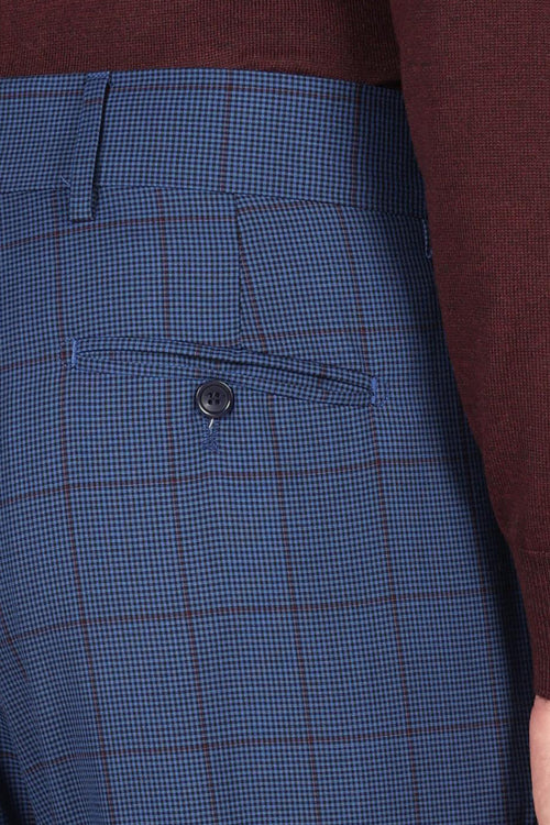 Pantaloni check con pinces in lana