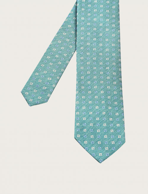 Cravatta in seta fantasia a piccoli quadrifogli