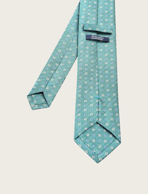 Cravatta in seta fantasia a piccoli quadrifogli