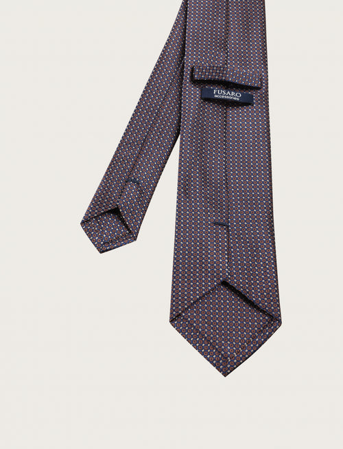 Cravatta in seta con micro fantasia geometrica all-over