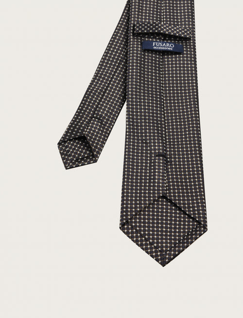 Cravatta in seta con micro fantasia geometrica all-over